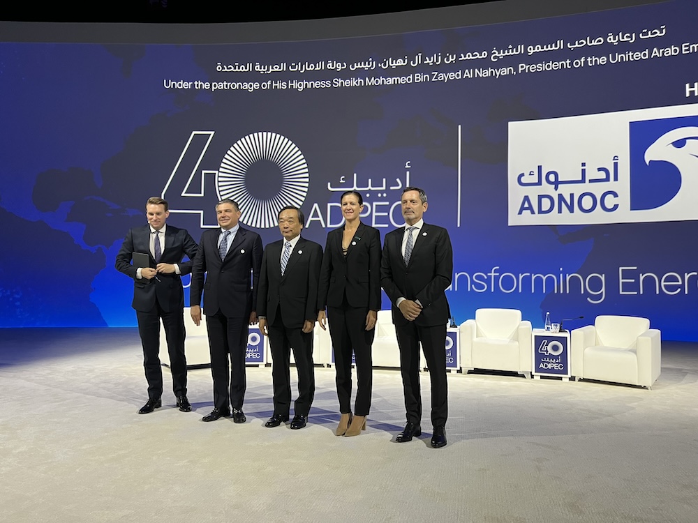 5 people onstage at the ADIPEC