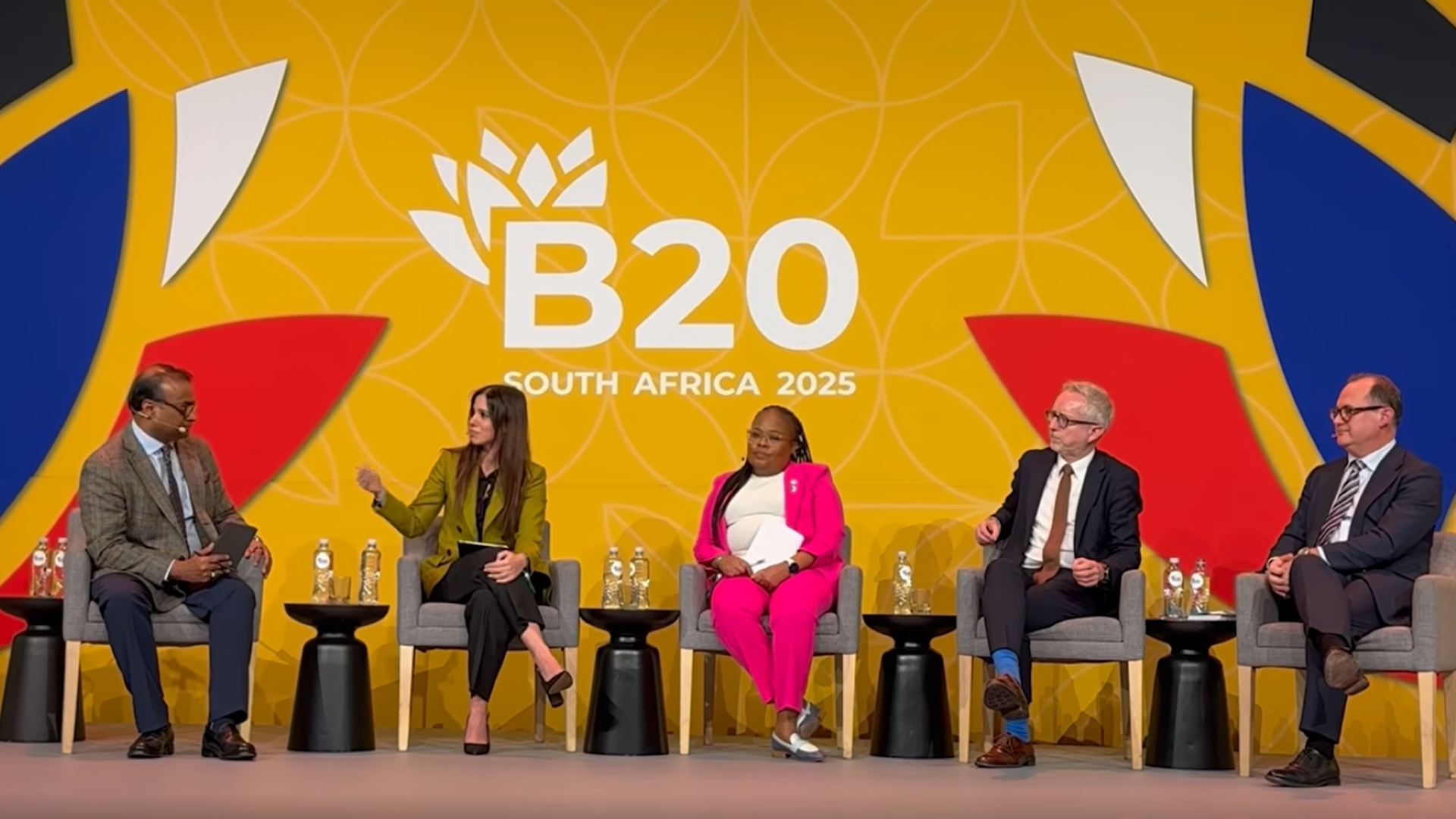 Panel in front of a yellow background that reads B20 South Africa 2025