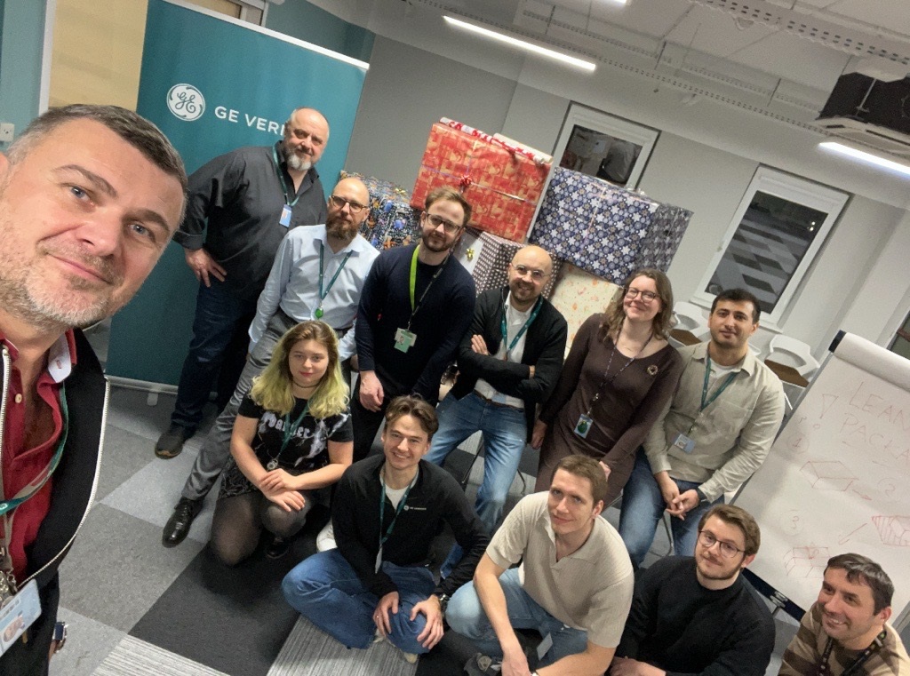 A group of GE Vernova volunteers pose for a team photo.